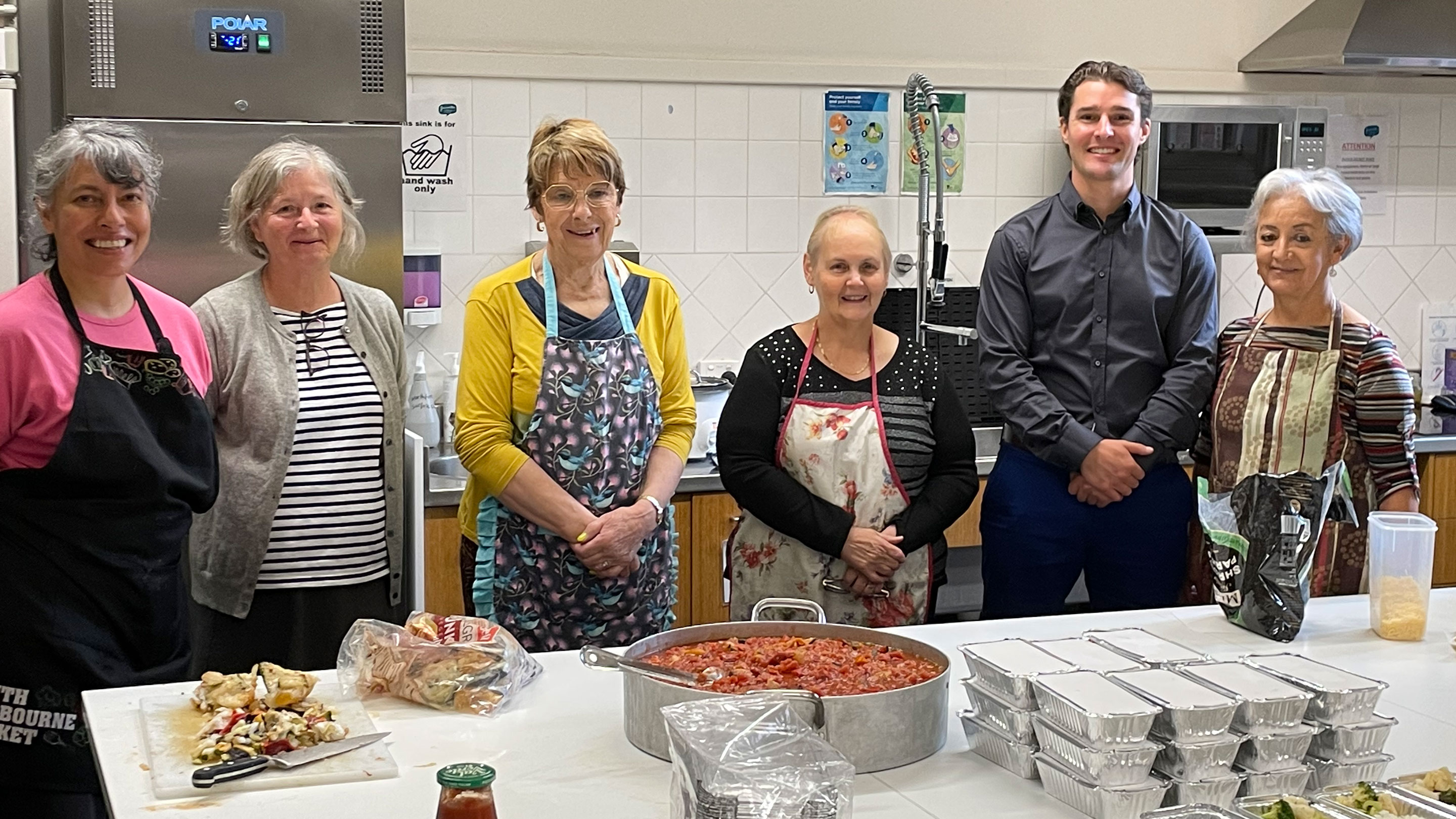 Image Yarravilles Assistant Terminal Manager, David Barker, visits the kitchen team preparing meals for the Nourish Project at YCC.