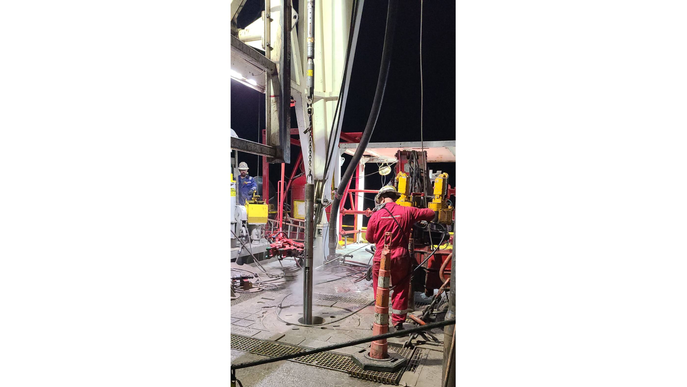 Workers pull up the tool that contains samples of lithium-rich brine.