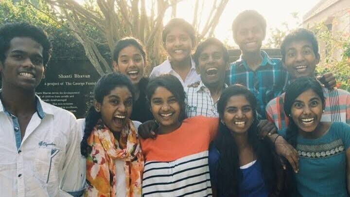 Image Anjali, back row, far left, with other former Shanti Bhavan students