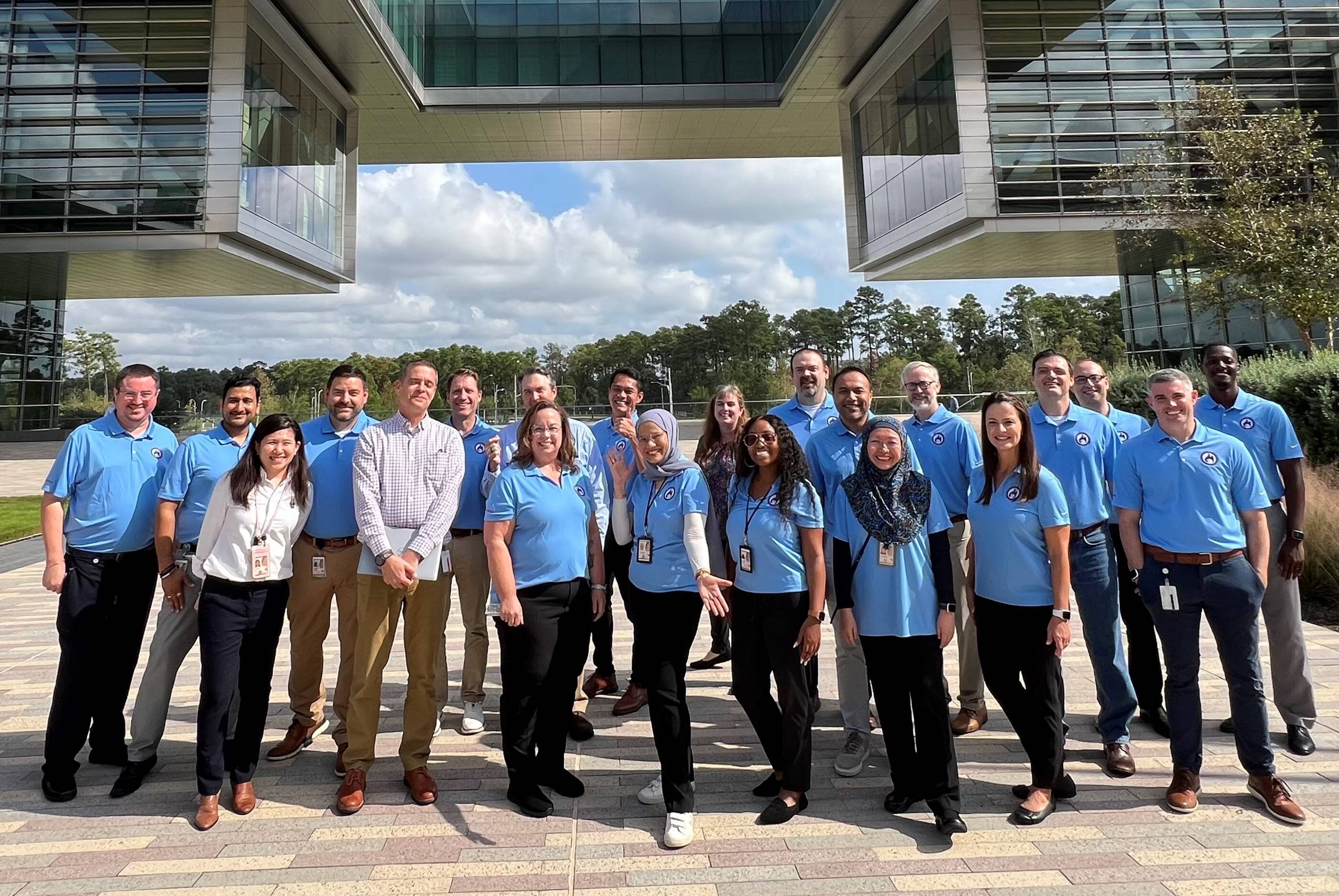 Intan with her Manager, Nick Swann (5thfrom left) and extended team in Houston.